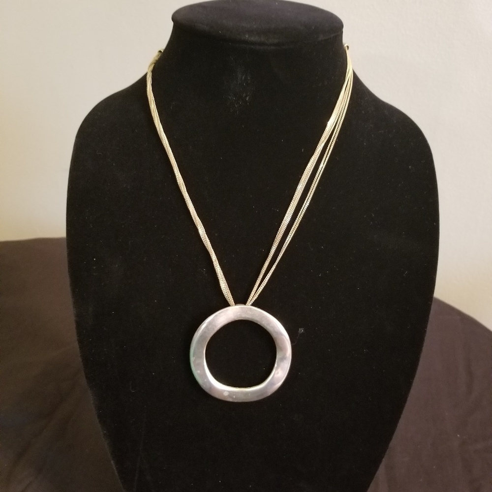 GOLD PENDANT HUNG BY 6 DAINTY CHAINS